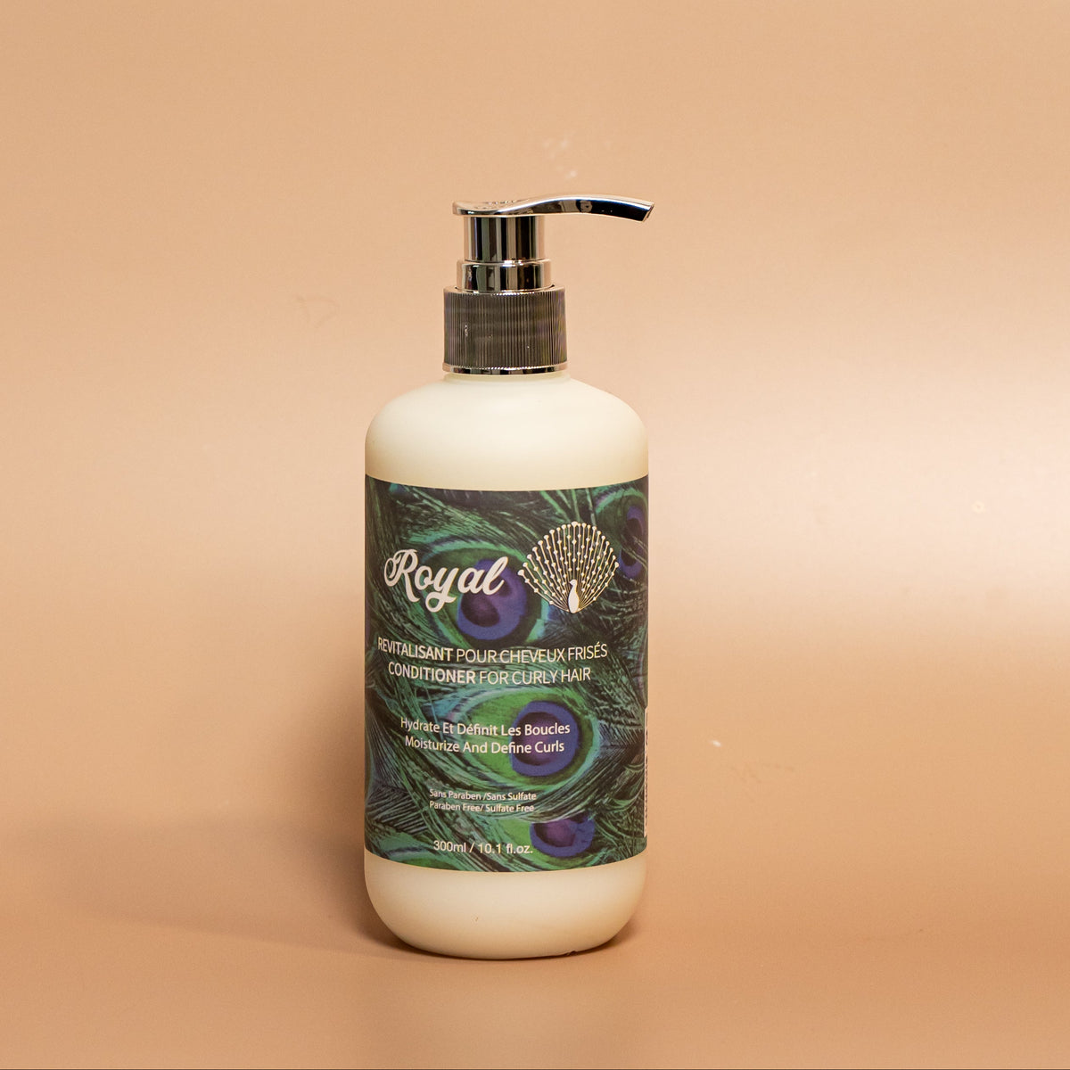 ROYAL Curly Hair Conditioner in a 300 ml pump bottle, featuring the signature peacock-inspired label against a warm beige studio background.