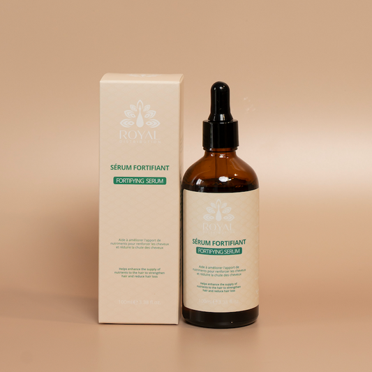 ROYAL Fortifying Hair Serum bottle photographed against a beige background.