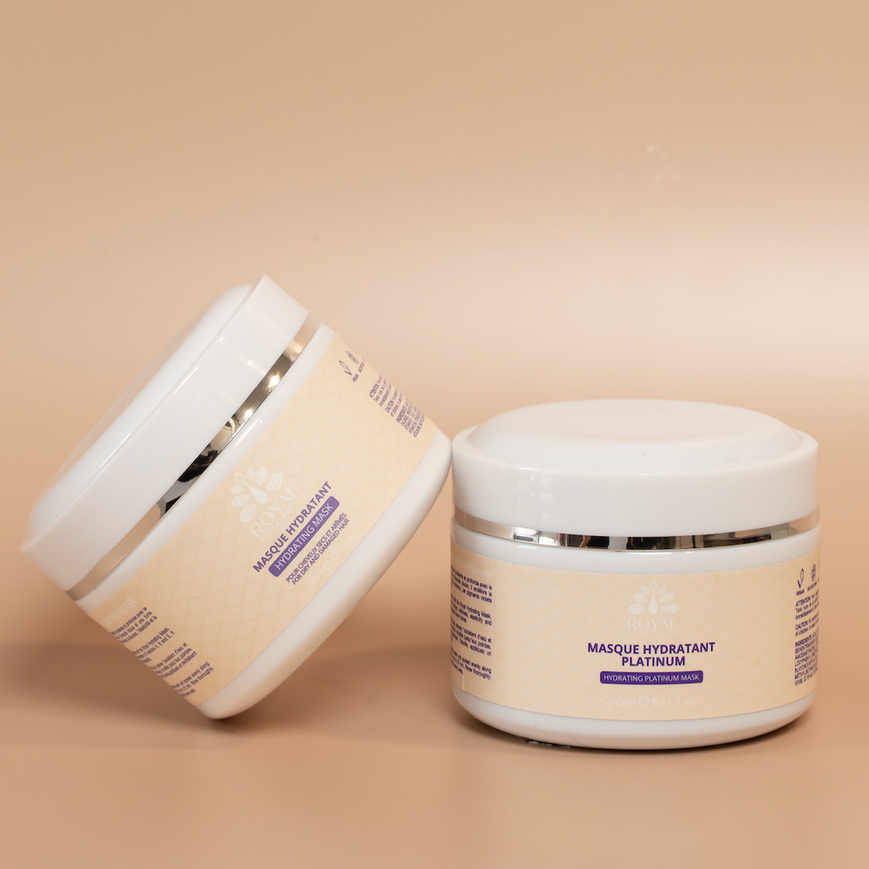 ROYAL Hydrating Hair Mask and Platinum Hydrating Hair Mask containers displayed together against a beige background.
