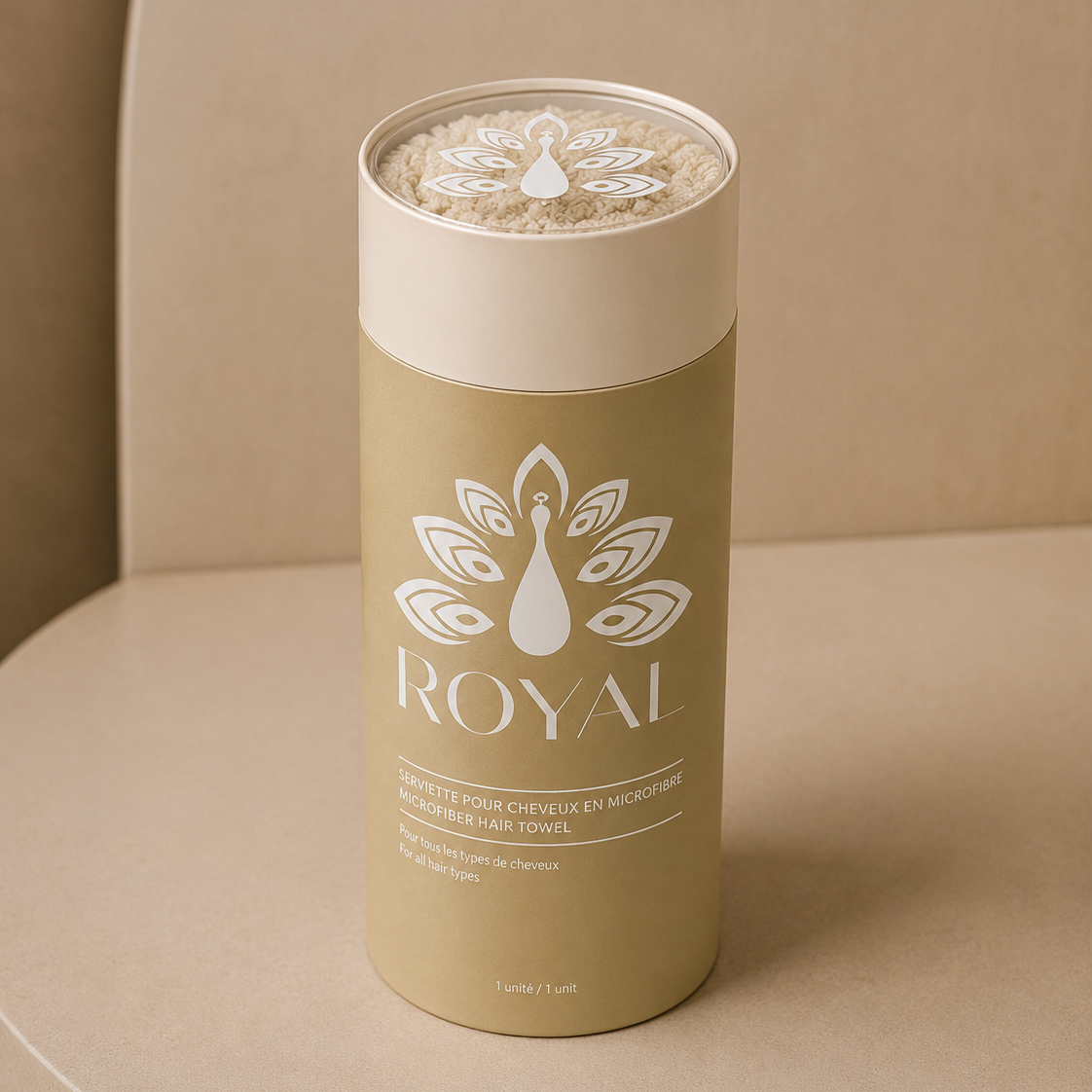 ROYAL beige microfiber hair towel presented in its elegant gold and beige cylindrical packaging, designed for gentle and effective hair drying.