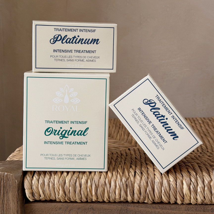 ROYAL Original and Platinum Intensive Hair Treatment boxes displayed in a warm neutral setting.