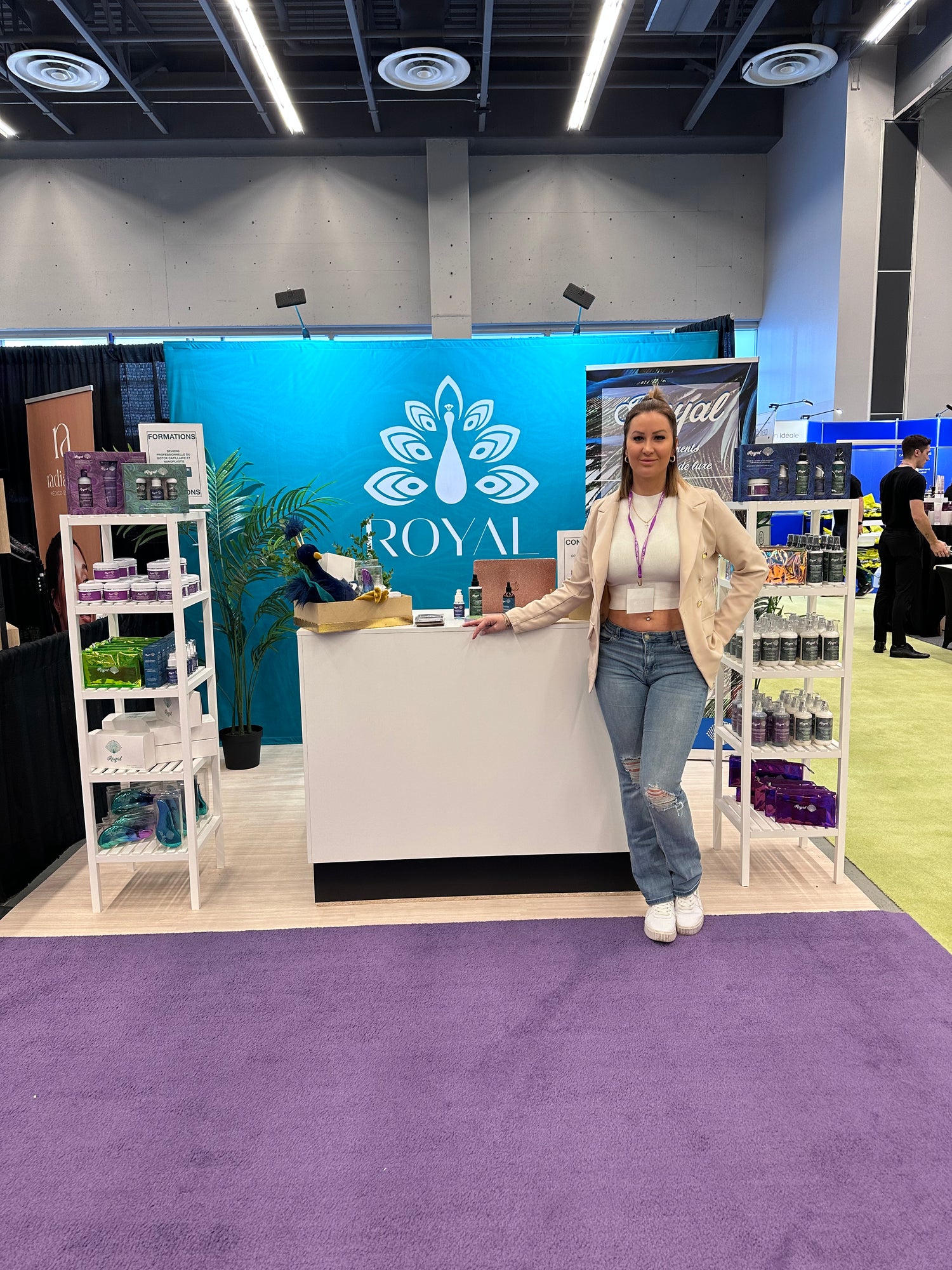 ROYAL professional haircare booth at the National Women’s Show in Montreal, featuring the ROYAL branded backdrop, professional haircare products and a ROYAL representative.